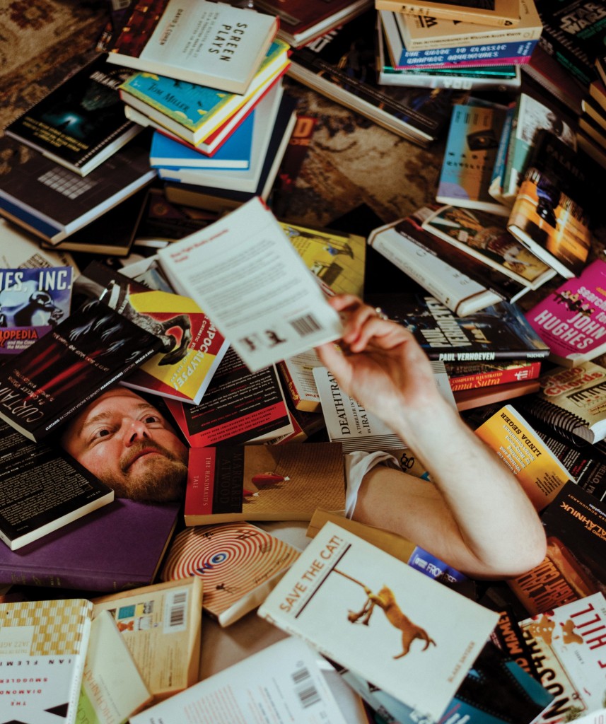 Brock and his books. // Photo by Travis Young