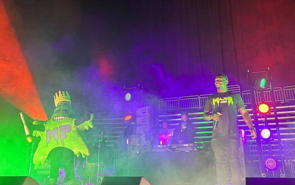 Macmo Green And Majorpac Mascot On Stage At T Mobile Center