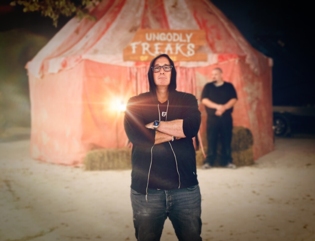 Darren Lynn Bousman stands in front of EXILED tent
