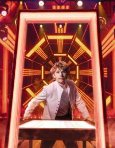 Flanagan as Tommy at the pinball machine