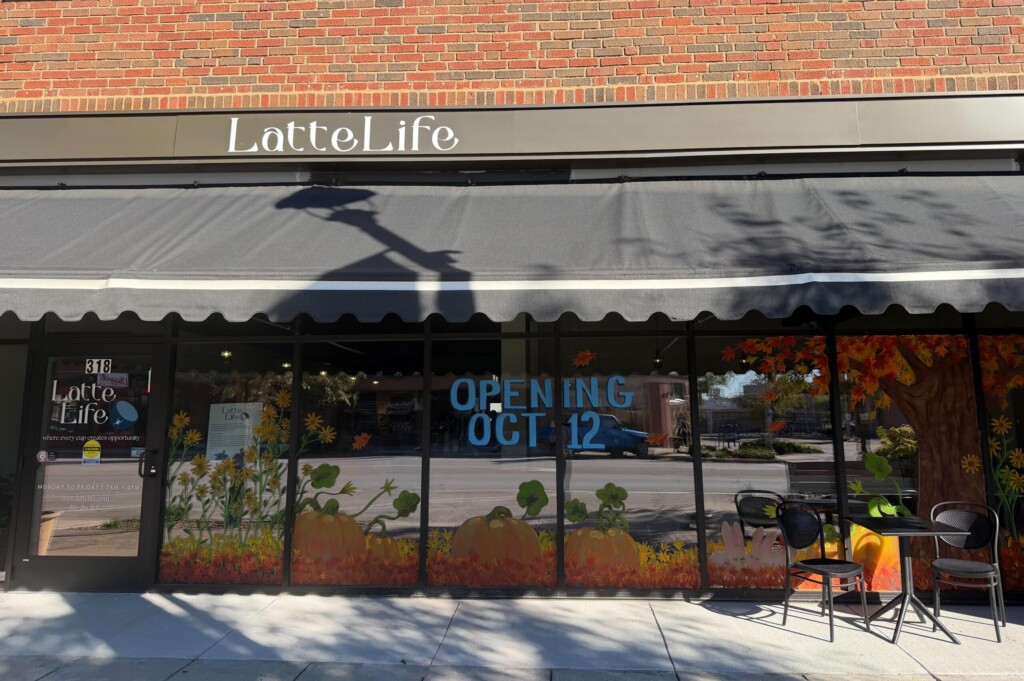 Latte Life's storefront with handpainted windows and the opening date, Oct. 12